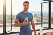 Active man holding men's wellness gummies after workout