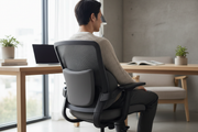 Memory foam lumbar cushion on office chair – lifestyle shot