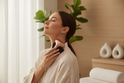 Person using AcheFly cupping massager on neck and shoulder